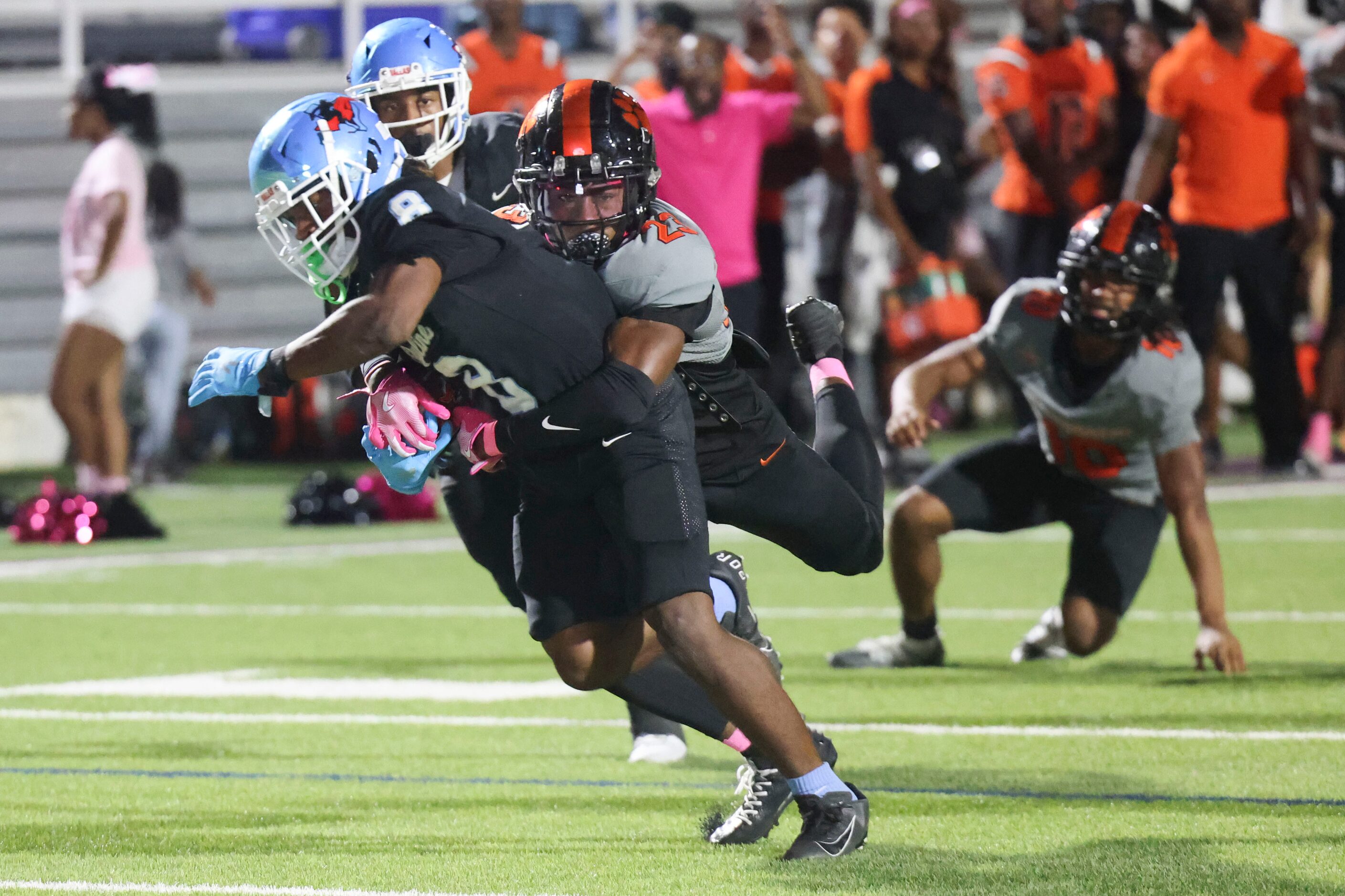 Lancaster High’s Patrick Berryman (23) tackles skyline high’s Tyreke Cockroft as he runs the...