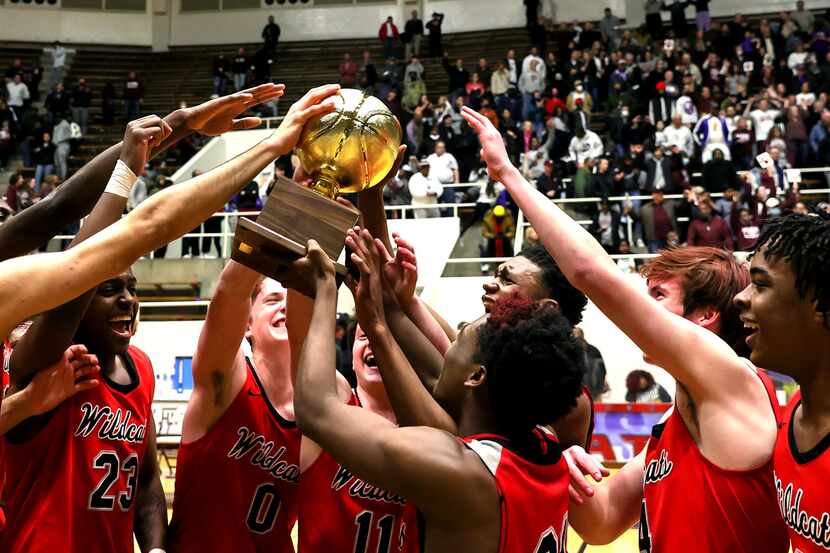 The Lake Highlands Wildcats celebrate their victory over Plano, 58-56 during in he 6A Region...