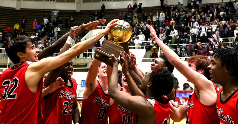 The Lake Highlands Wildcats celebrate their victory over Plano, 58-56 during in he 6A Region...