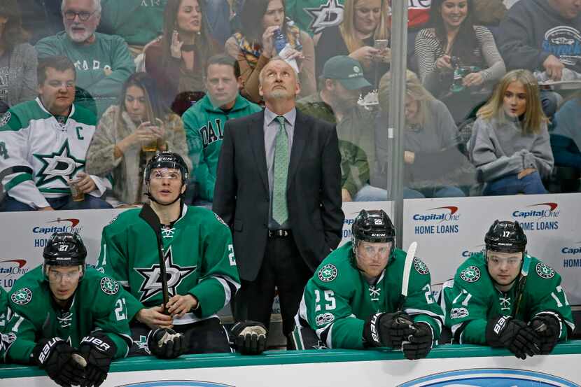 Dallas Stars head coach Lindy Ruff looks at the score board during the second period against...