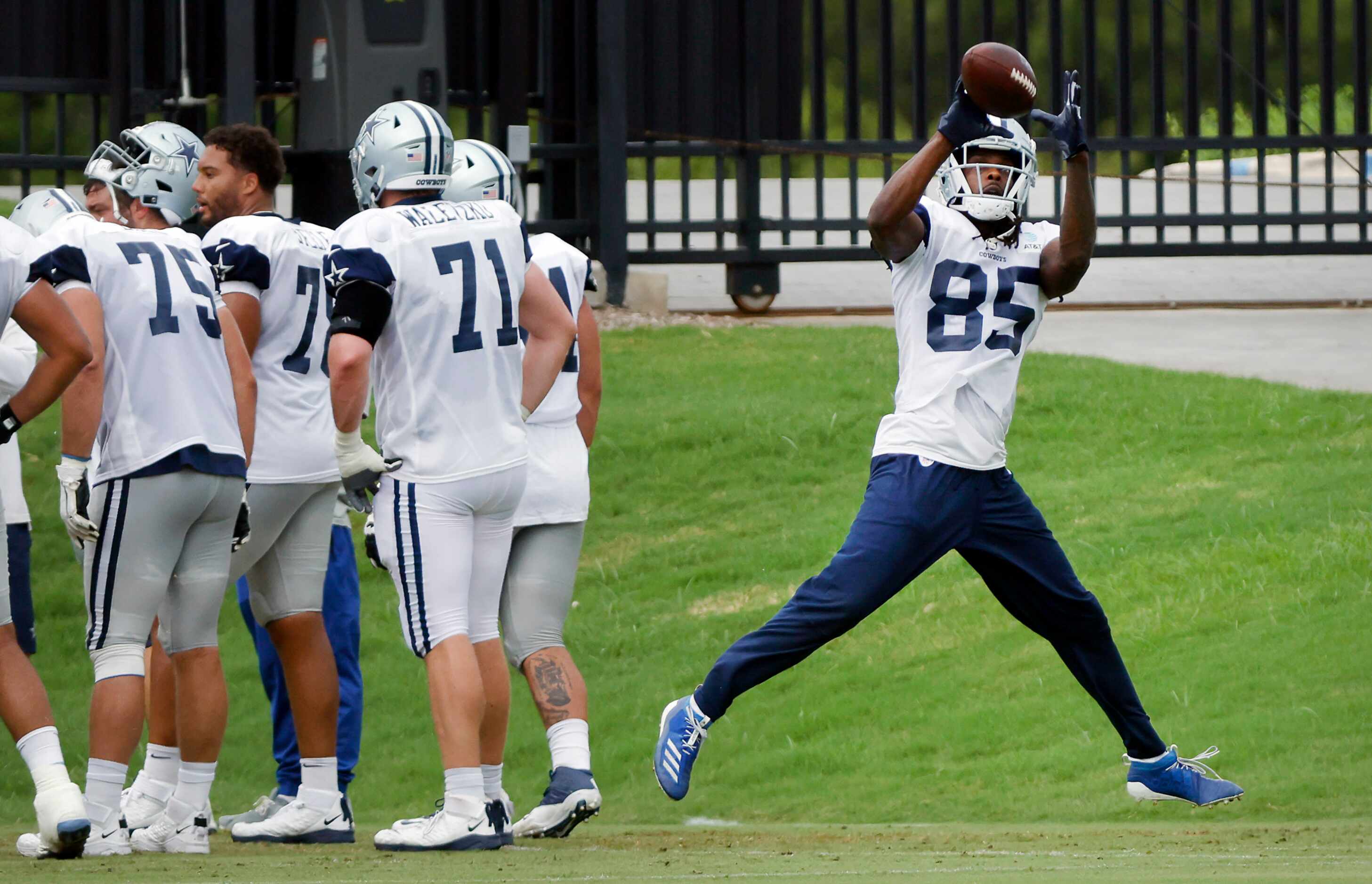 Dallas Cowboys wide receiver Noah Brown (85) pulls down a pass during practice at The Star...