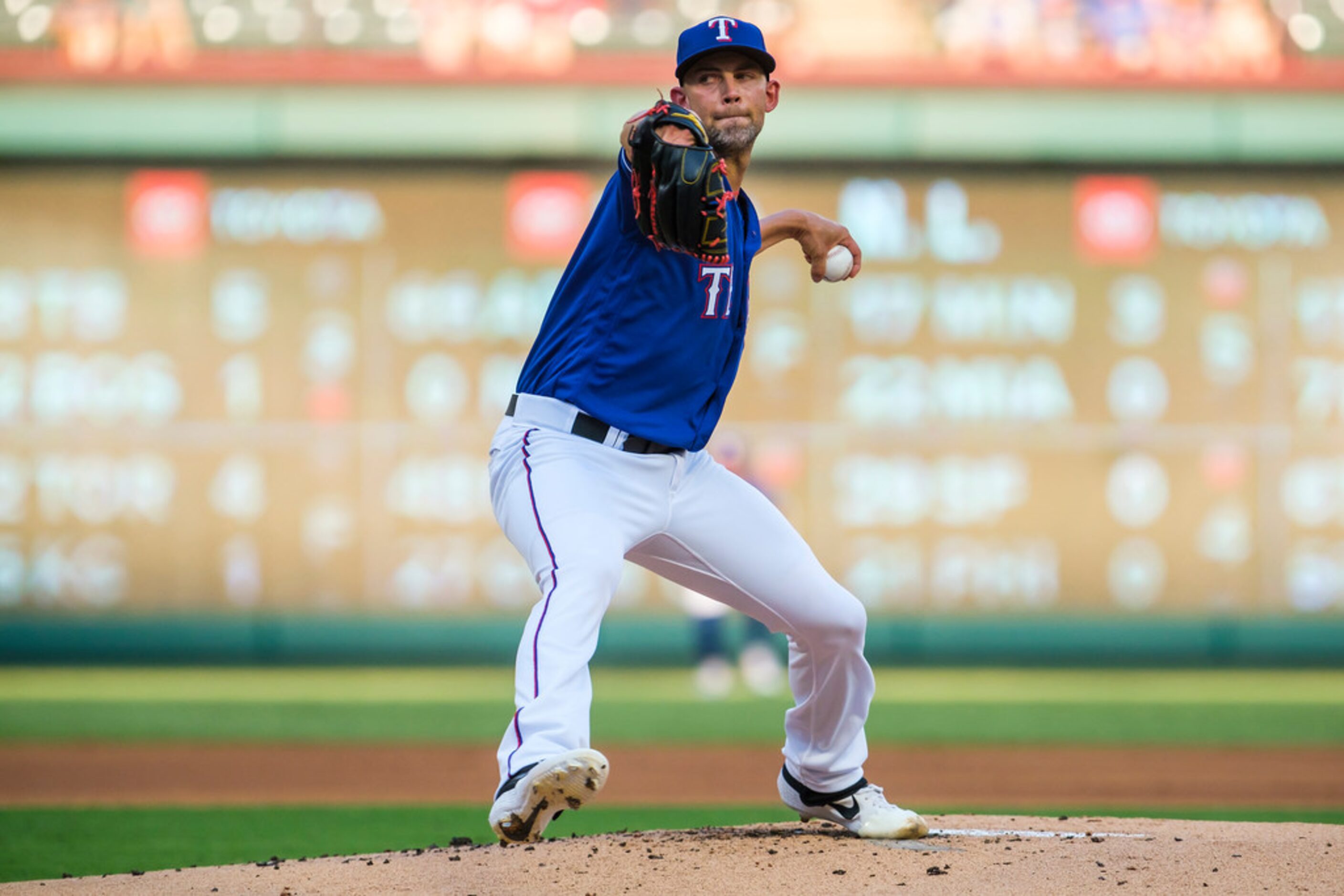 Texas Rangers starting pitcher Mike Minor delivers during the first inning against the...