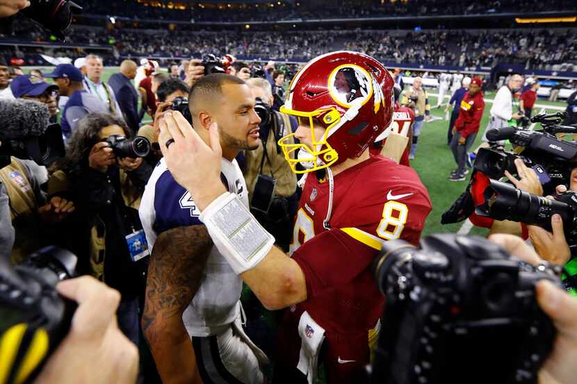 FILE - Washington Redskins quarterback Kirk Cousins (8) congratulates Cowboys quarterback...