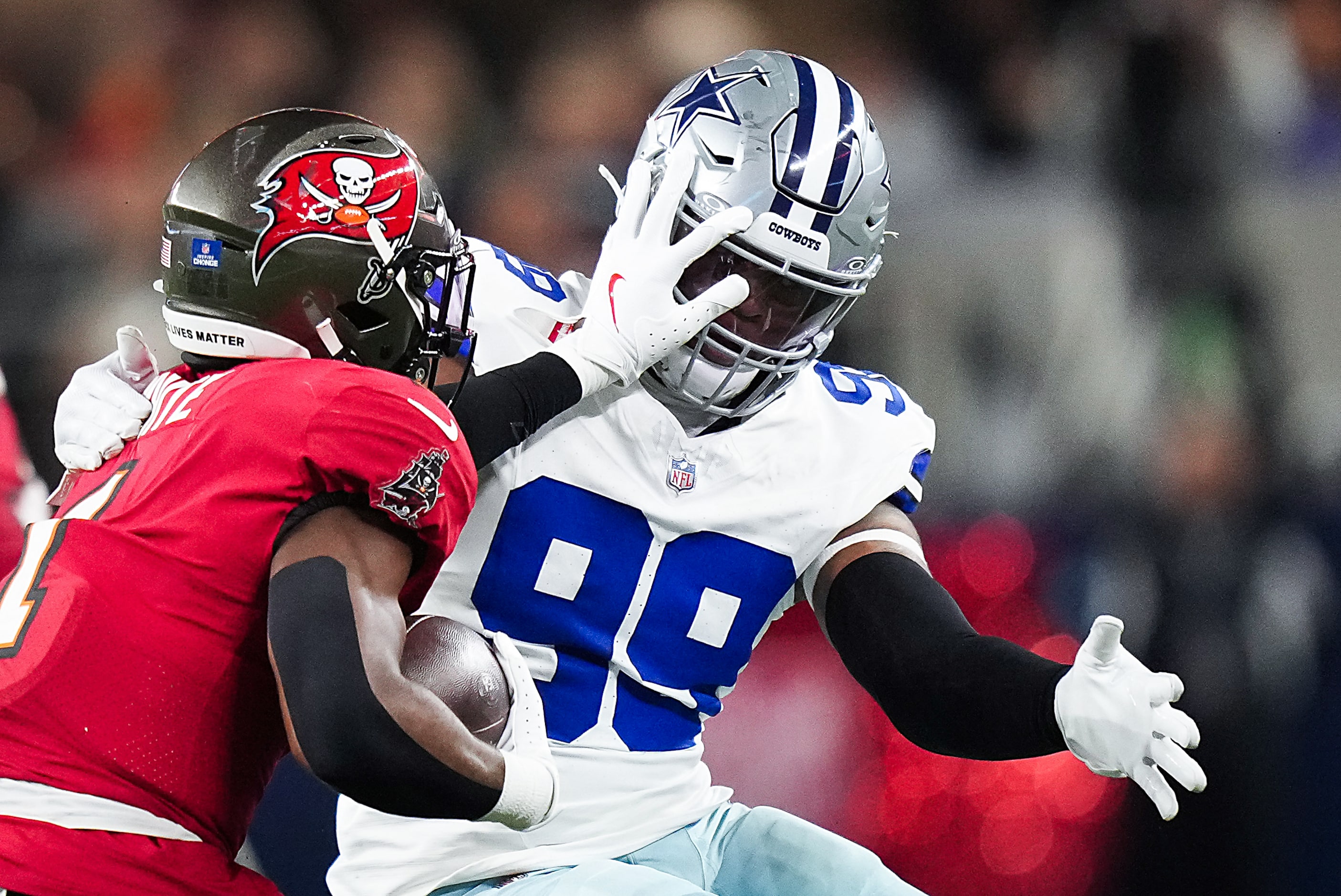 Dallas Cowboys defensive end Chauncey Golston (99) brings down Tampa Bay Buccaneers running...