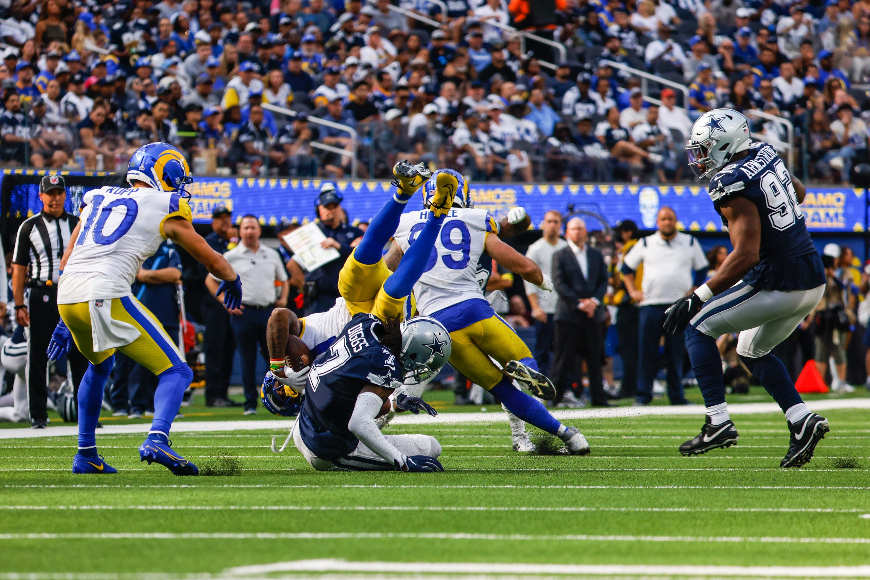 Dallas Cowboys cornerback Trevon Diggs (7) tackles Los Angeles Rams running back Darrell...