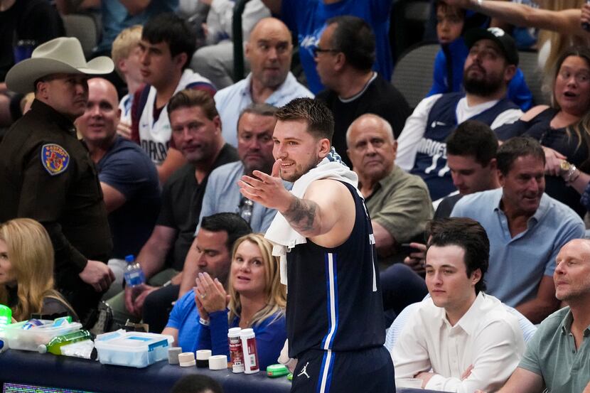 Dallas Mavericks guard Luka Doncic (77) celebrates after a foul call against him was...
