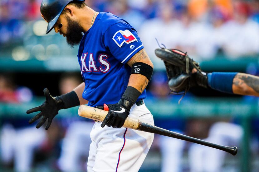 Texas Rangers second baseman Rougned Odor (12) reacts to a strike during the second inning...