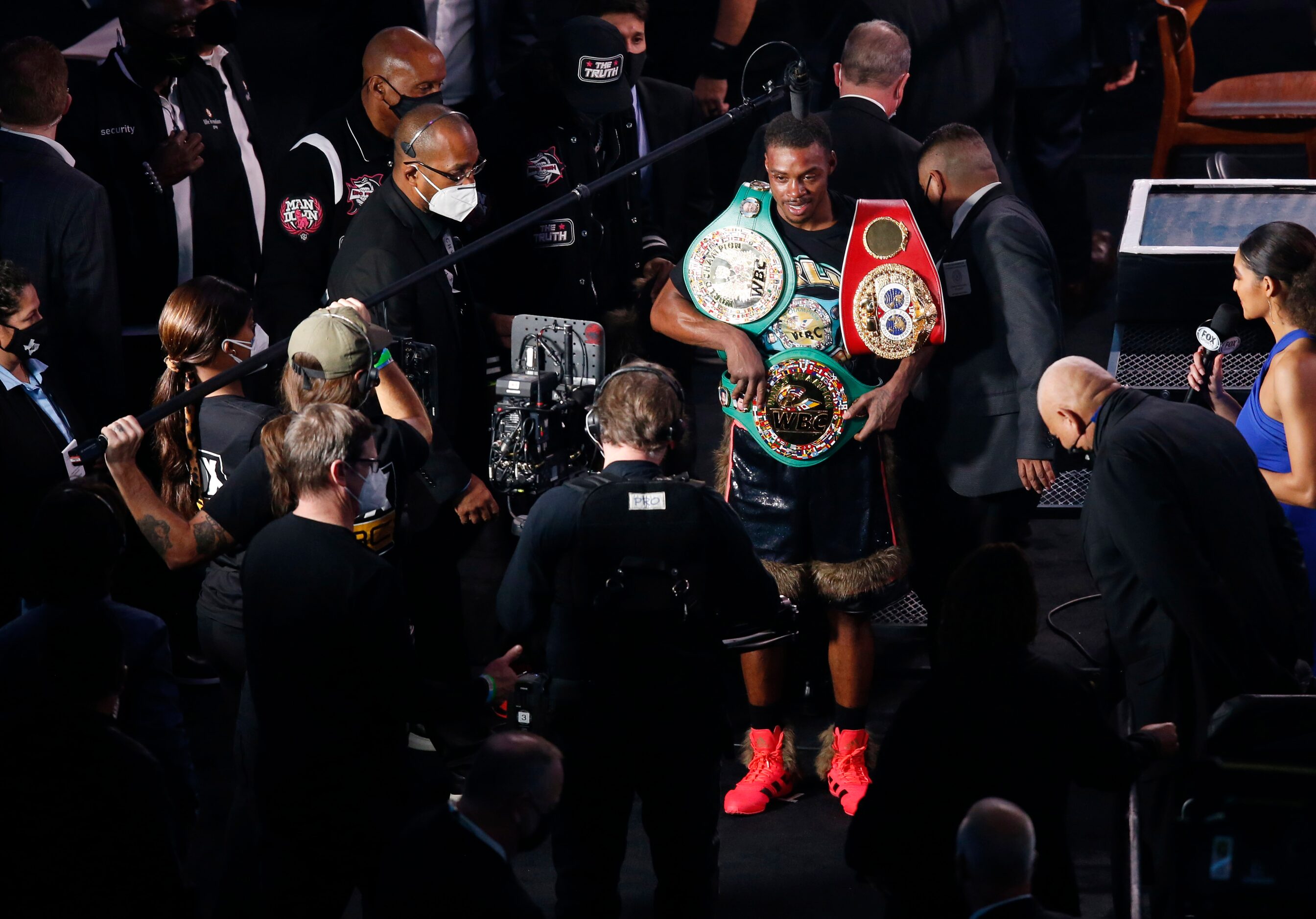 Errol Spence, Jr. with his championship belts after defeating Danny García in a WBC & IBF...