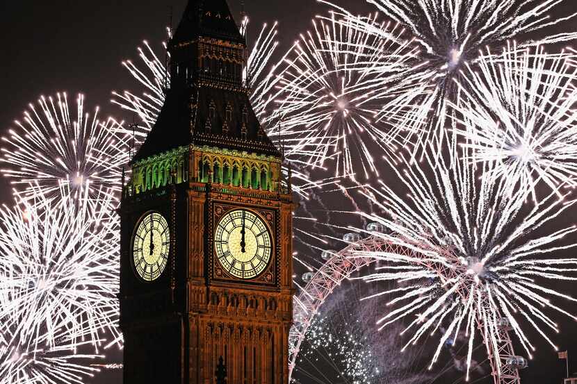 LONDON, ENGLAND - JANUARY 01:  Fireworks light up the London skyline and Big Ben just after...