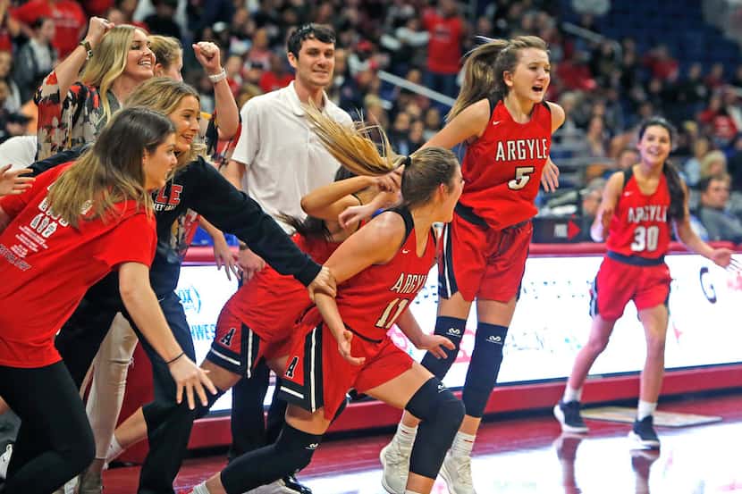 Argyle's Rhyle McKinney leads the charge after the final buzzer. UIL girls basketball 4A...