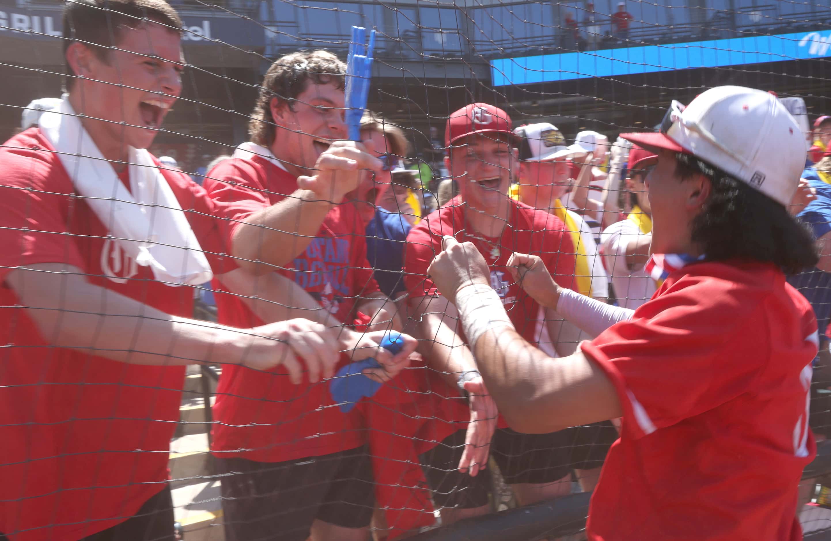 Grapevine's Collin Park (5), right, celebrates with fans after the Mustangs' 6-5 victory...