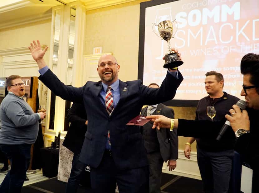 Sommelier Daniel Miller from Grace restaurant celebrates after winning the Somm Smackdown at...