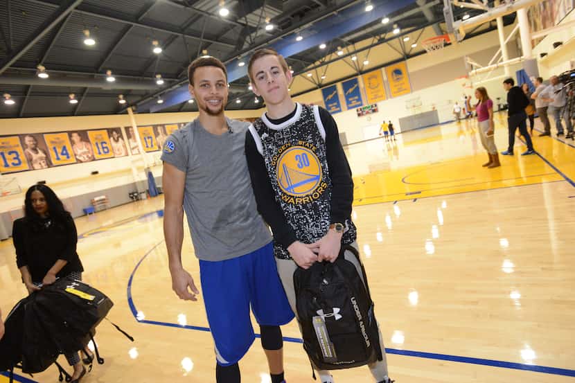 Golden State's Stephen Curry poses with Nick Bacino of Flower Mound at a recent Make-A-Wish...