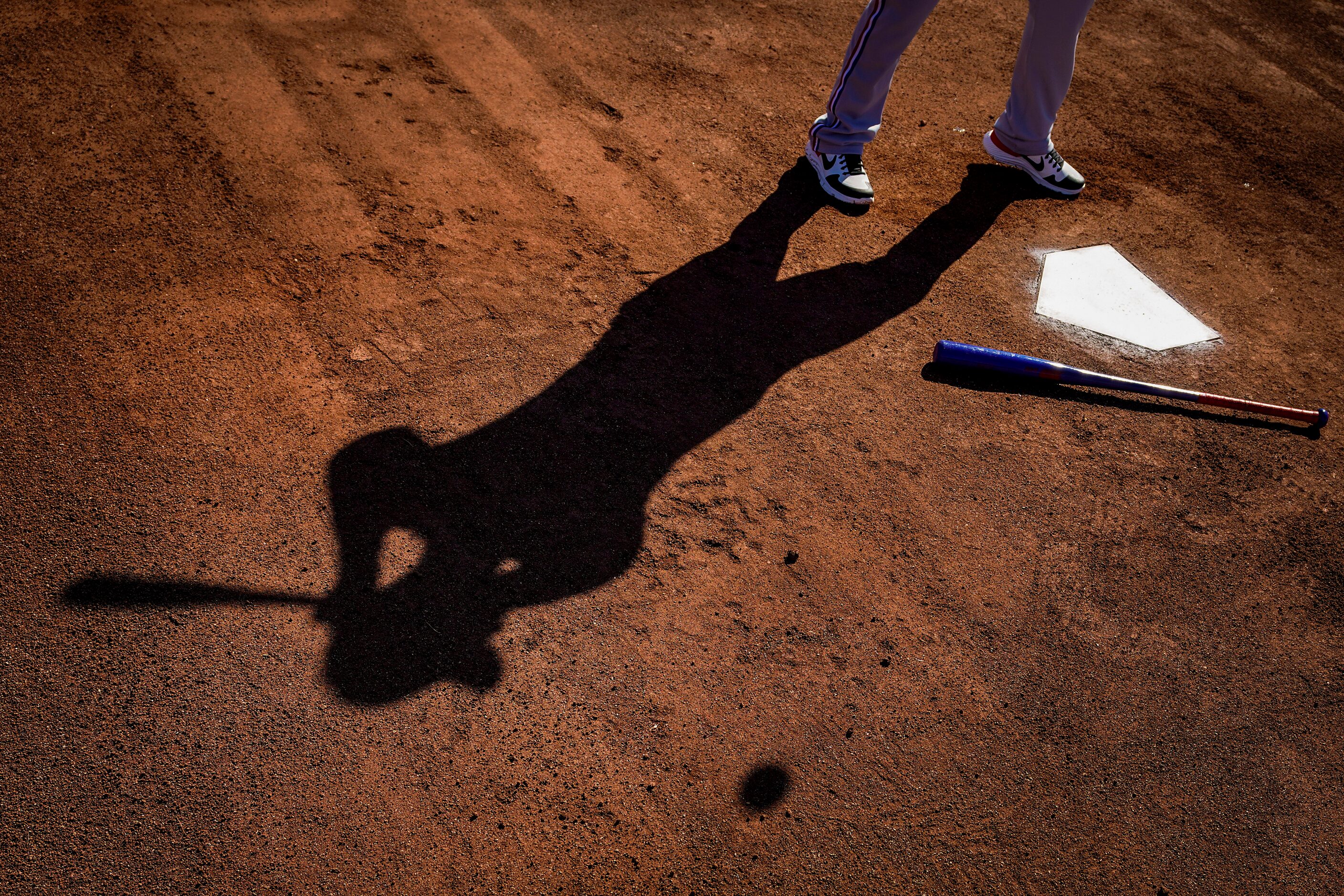 Darwin Barney, the Texas Rangers AAA Nashville manager, hits grounders for pitchers fielding...