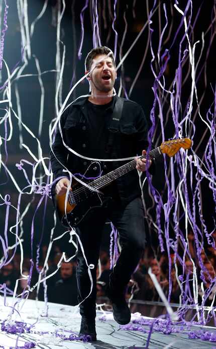 Fall Out Boy's lead guitarist Joe Trohman performs on stage during a Mania Tour concert at...