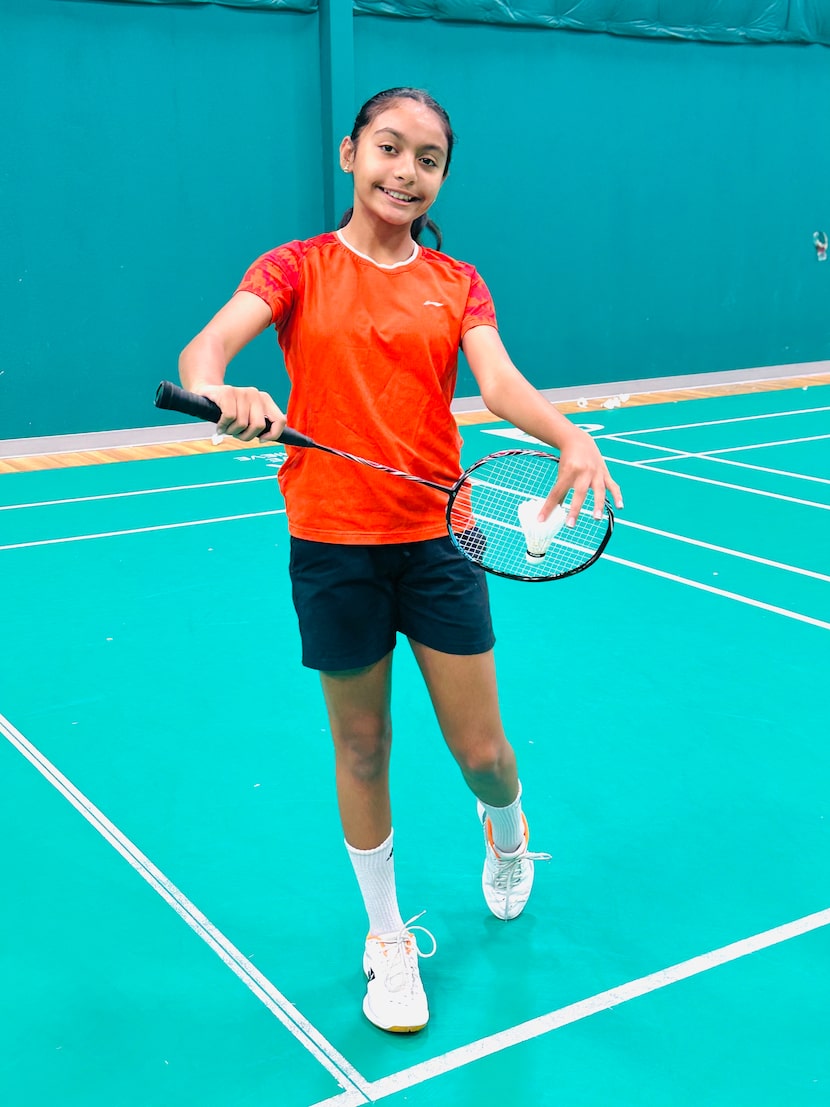 Aashi Gupta, 13, at Frisco Badminton Academy during a July practice. Her father Amit Gupta,...