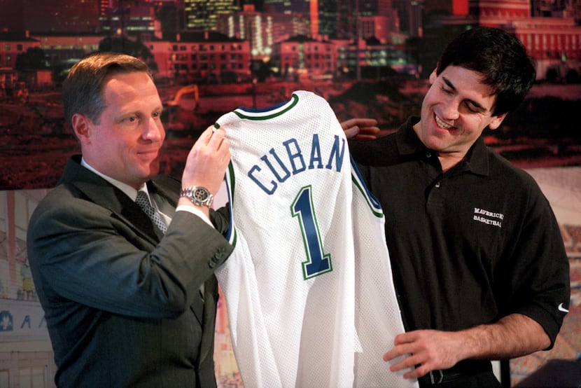 January 20, 2000: Ross Perot Jr. (left) presents Mark Cuban with a Dallas Mavericks jersey...