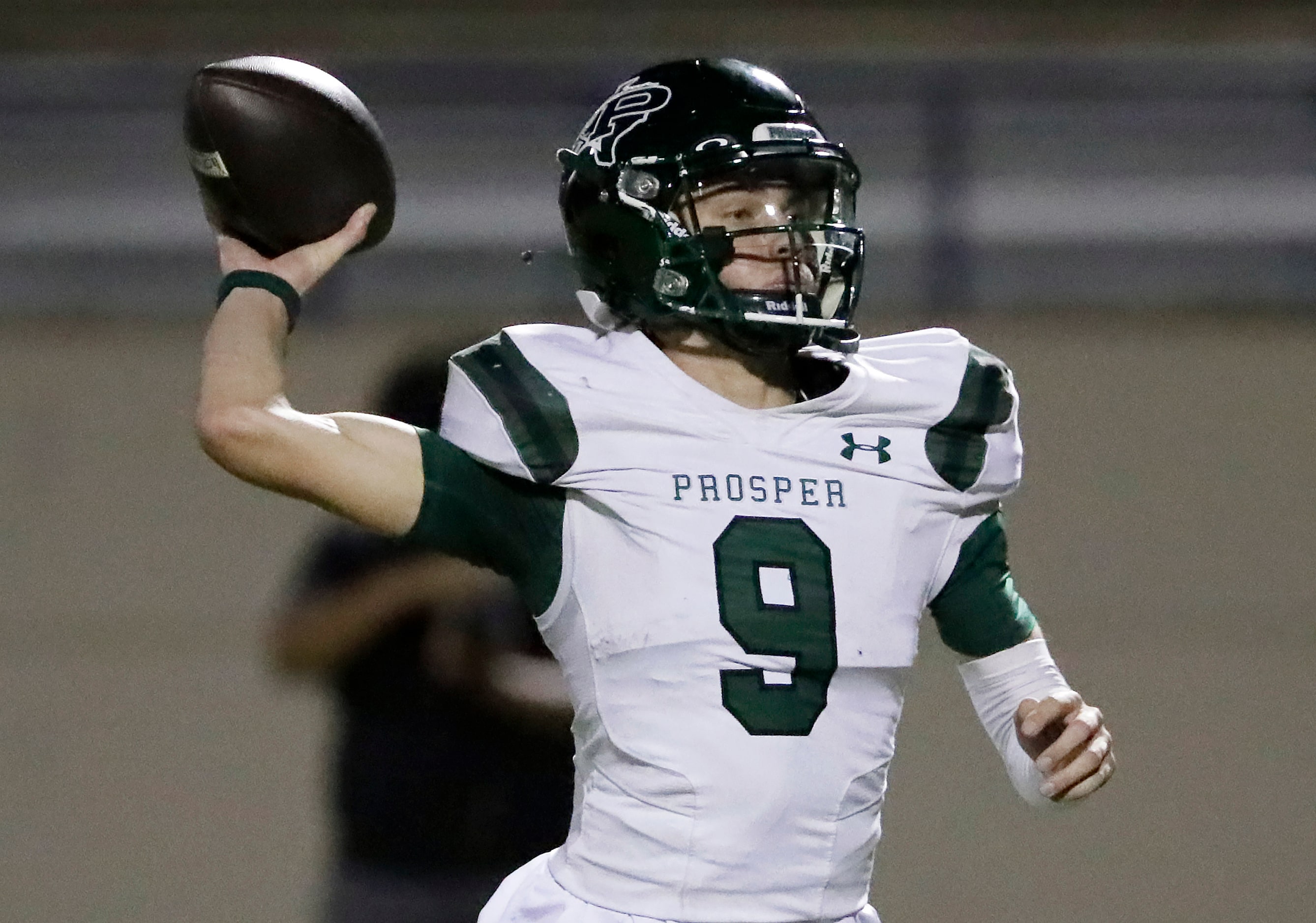 Prosper High School quarterback Braeden Imhoff (9) throws a pass during the first half as...