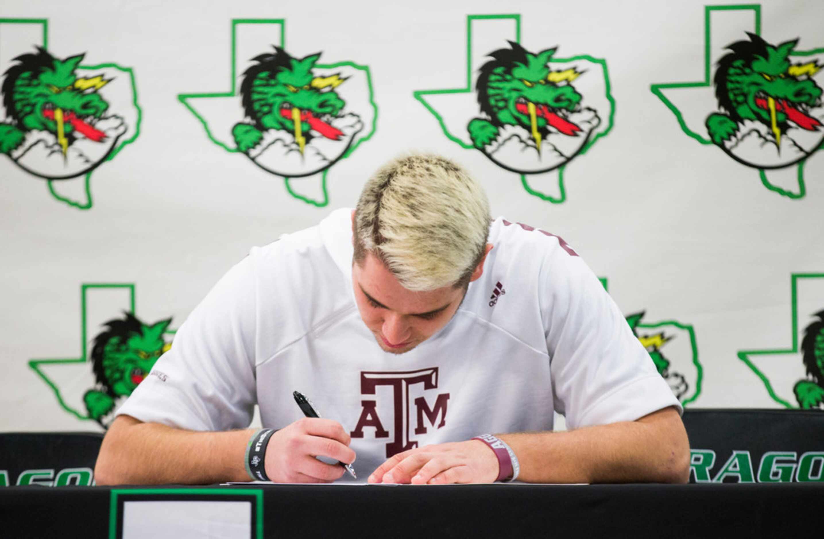 Southlake Carroll football player Blake Smith signs a national letter of intent to attend...