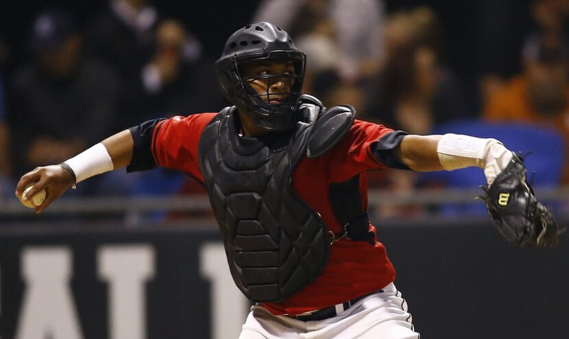 Rockwall-Heath catcher Canaan Smith throws to second in their high school baseball game...