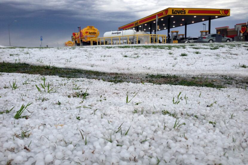 Hailstones blanketed the ground in south Dallas County on Saturday. The unseasonable weather...