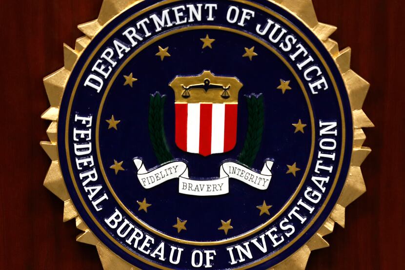 The Department of Justice and FBI plaque at the Dallas FBI field office on Monday, August...