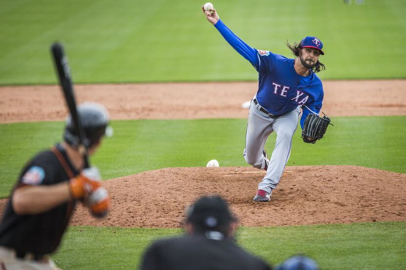 Texas Rangers pitcher Tony Barnette pitches during a spring training game against the San...