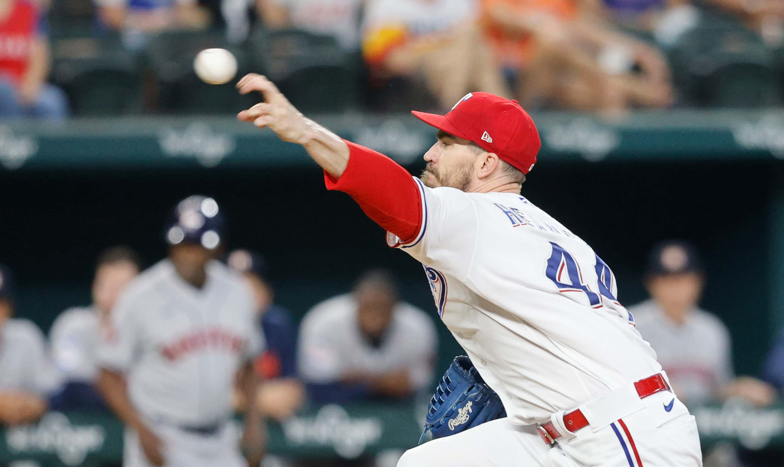 Texas Rangers starting pitcher Andrew Heaney (44) delivers during the second inning of a...