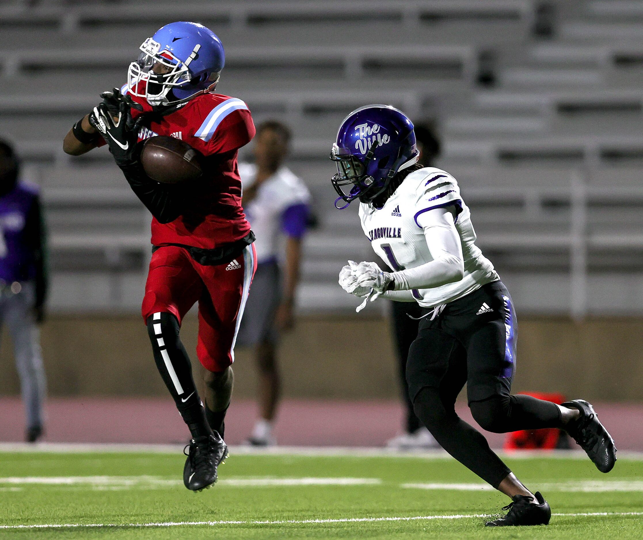 Thomas Jefferson defensive back Jeremiah Alexander (left) almost comes up with an...