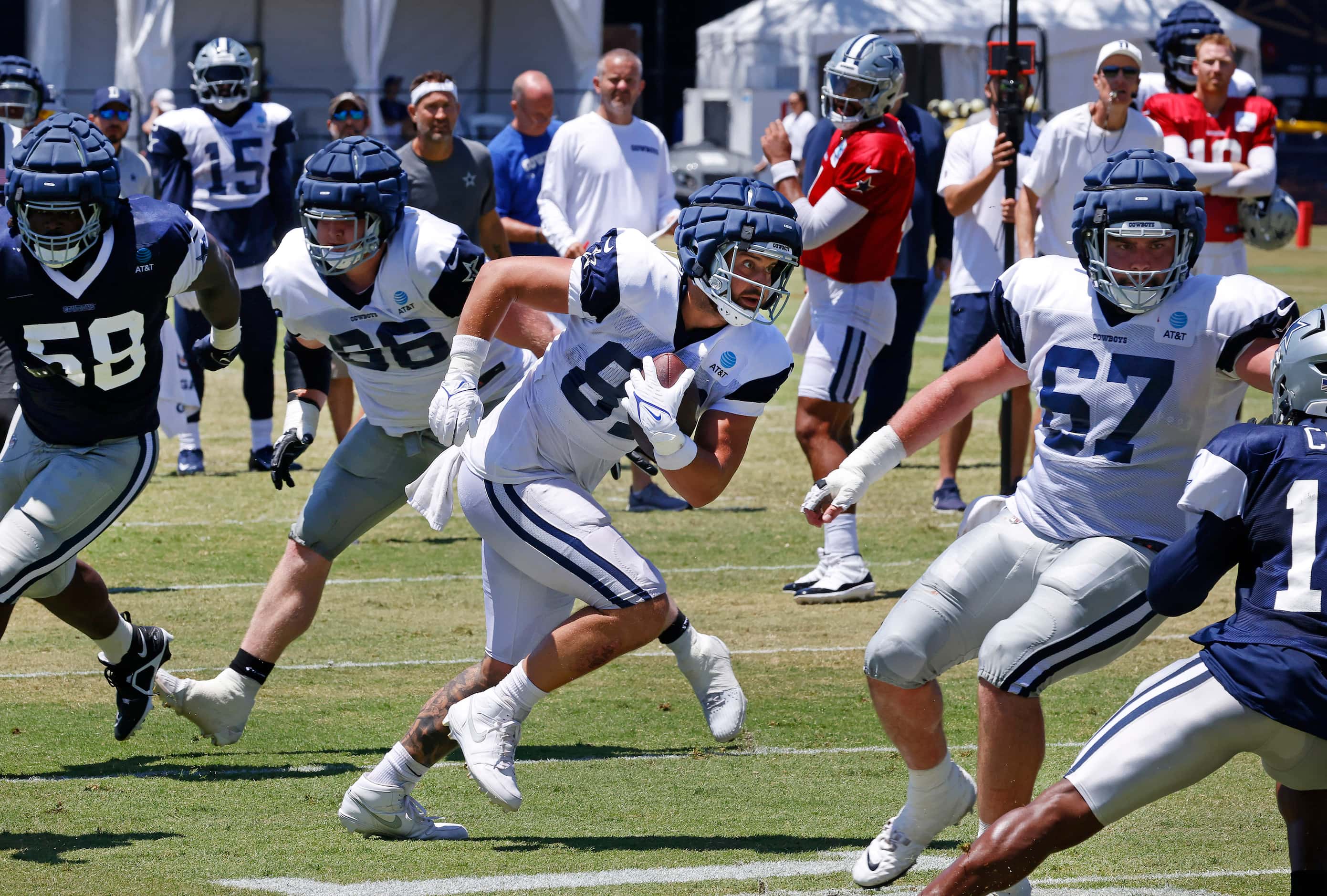 Dallas Cowboys tight end Jake Ferguson (87) makes a  catch and runs against the defense ...