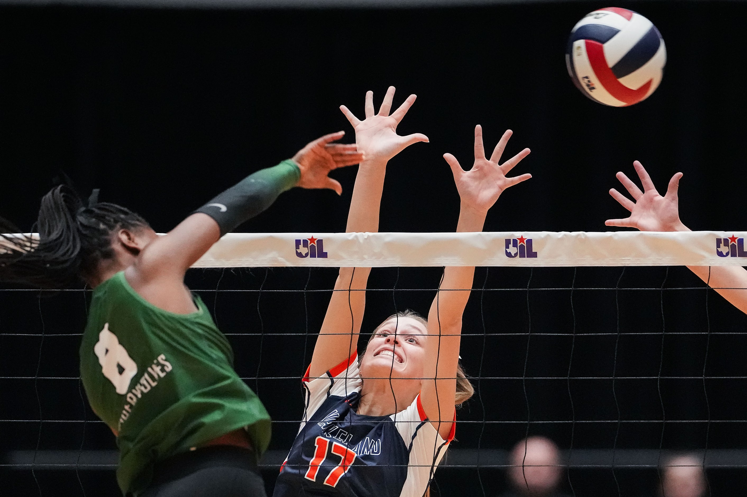 Cedar Park's Mya Cheatum (8) hits over the block of Frisco Wakeland's Sloane Kennedy (17)...