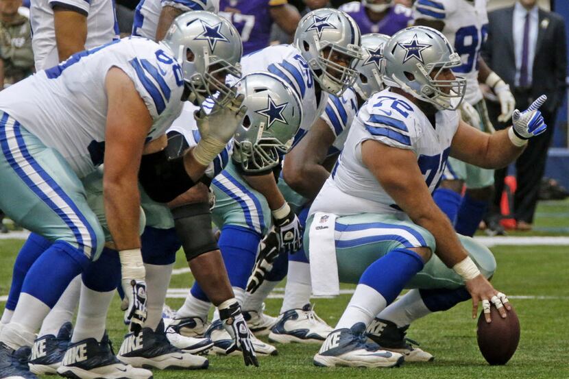 Dallas Cowboys center Travis Frederick (72) and teammates come to the line of scrimmage for...
