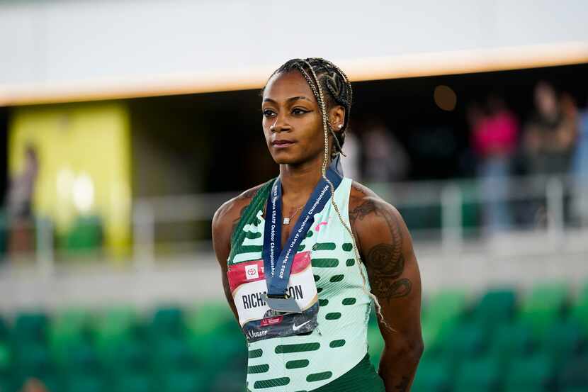 Sha'Carri Richardson, who won the gold medal in the women's 100 meter final, stands during a...
