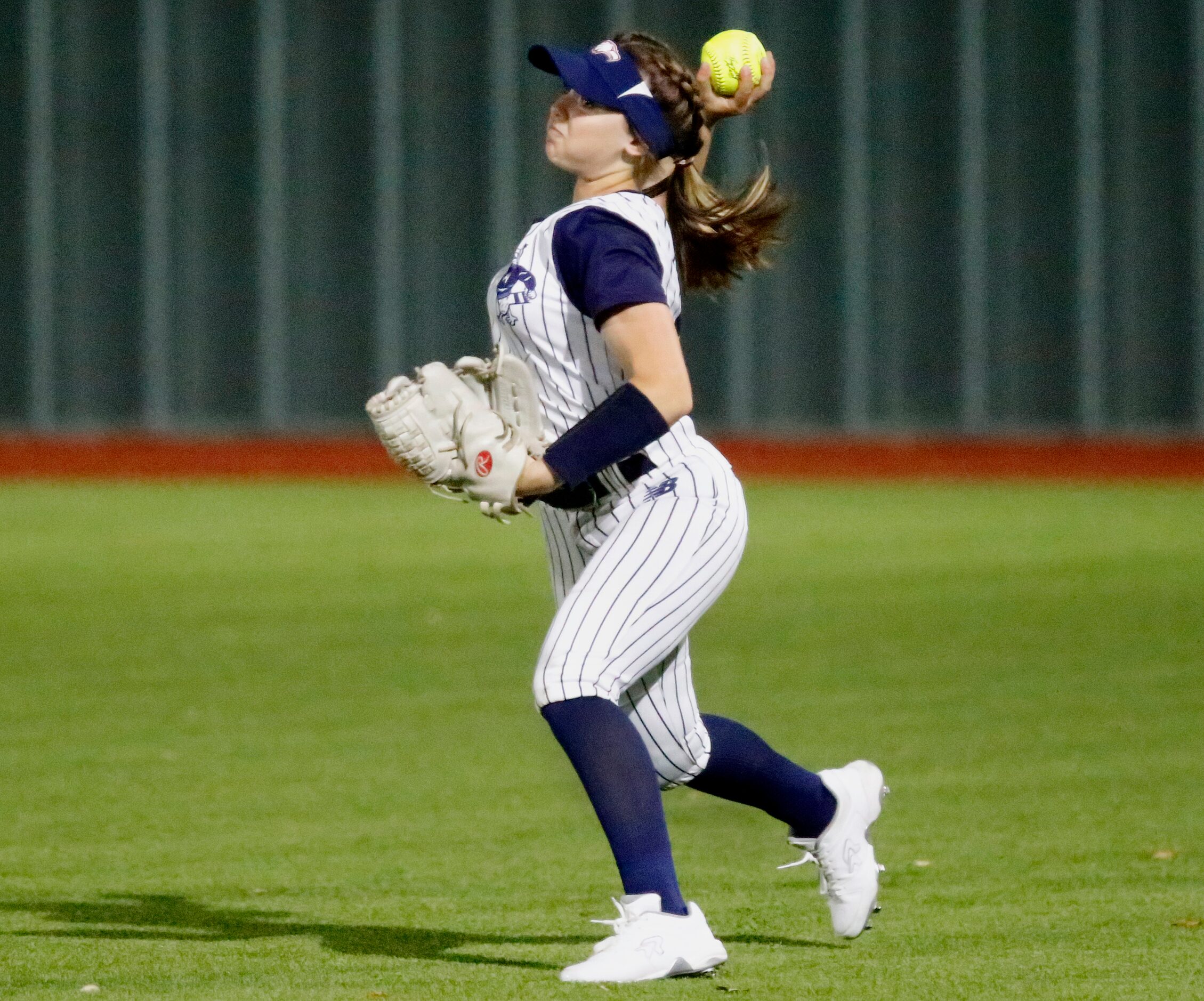 Allen High School right fielder Jaydyn Beall (18) returns the ball to the infield in the...