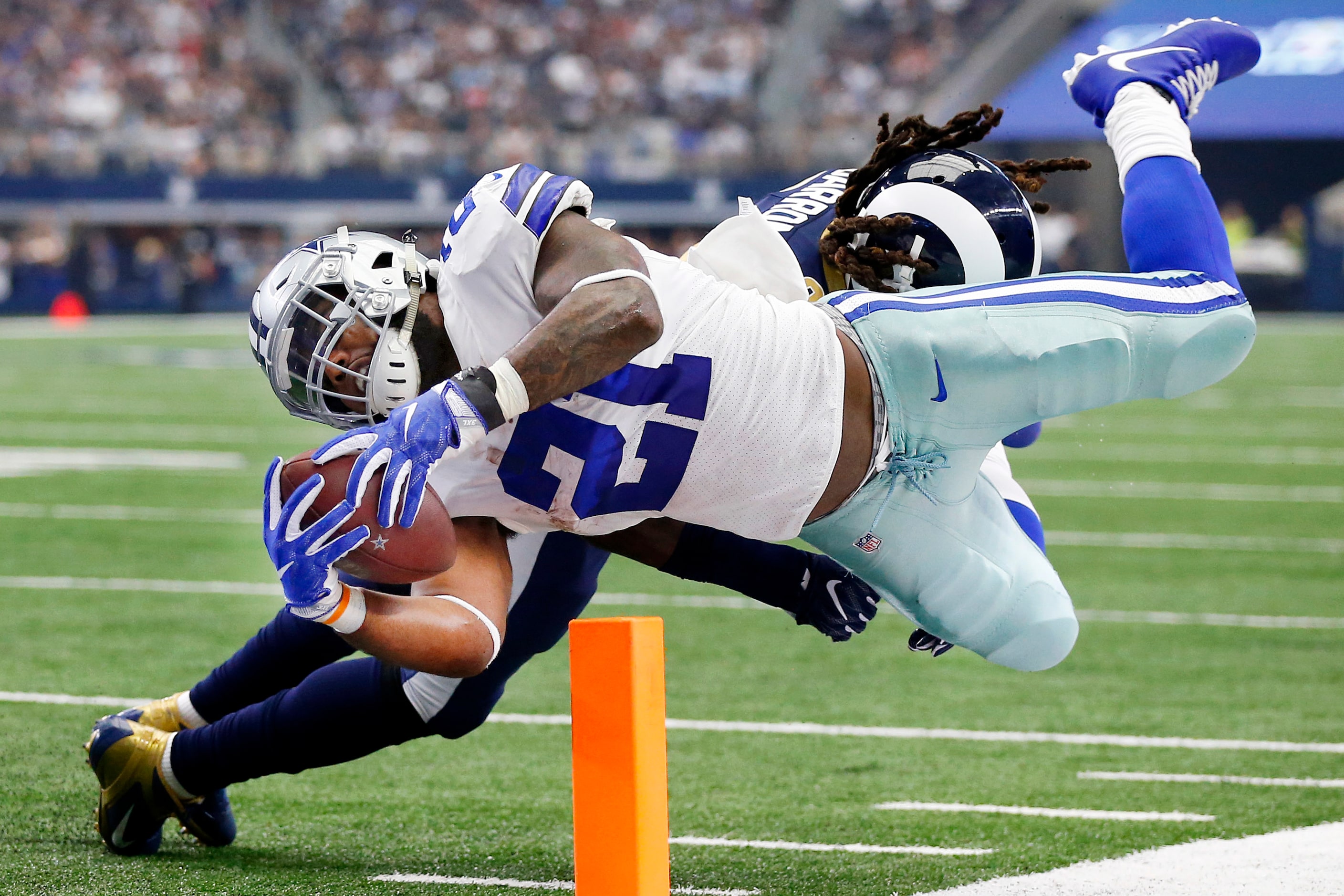 Dallas Cowboys running back Ezekiel Elliott (21) dives across the goal line for a second...