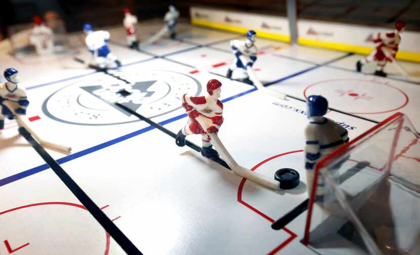 Bubble hockey is one of the numerous games you can play at Sports and Social at Texas Live...