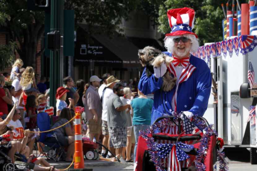 Danny Cox took part in the 4th of July parade with some of his dogs in downtown McKinney...