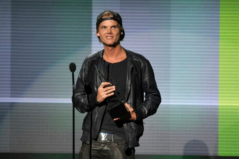 FILE - In this Nov. 24, 2013 file photo, Avicii accepts the award for favorite artist -...