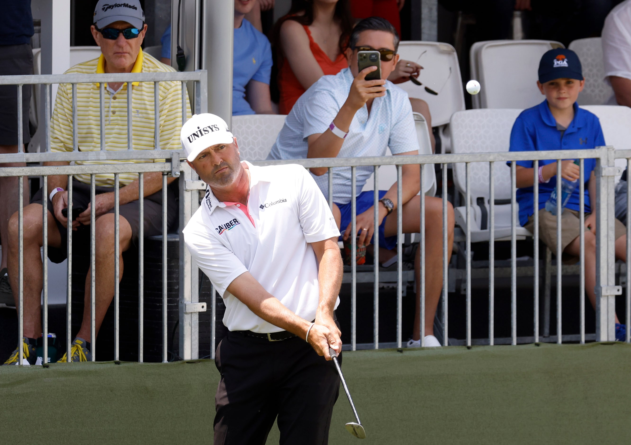 Ryan Palmer watches the ball get on the green on the 17th hole during round 3 of the AT&T...