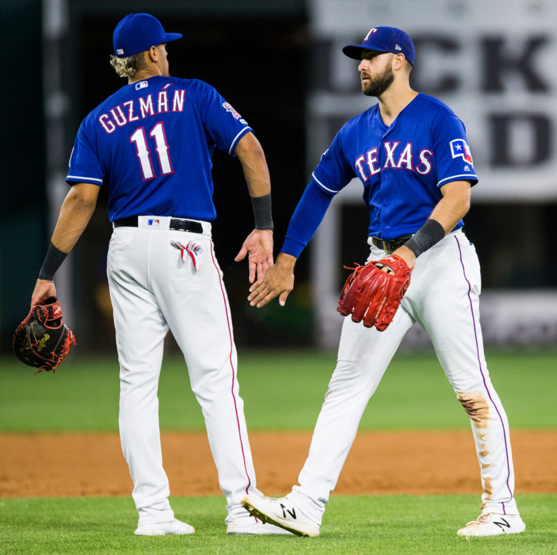 Texas Rangers first baseman Ronald Guzman (11) and center fielder Joey Gallo (13) celebrate...