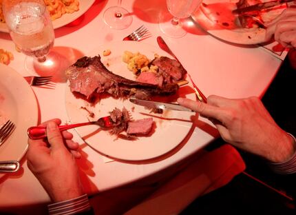 Guests enjoyed a several-course meal served under the glow of red lights.