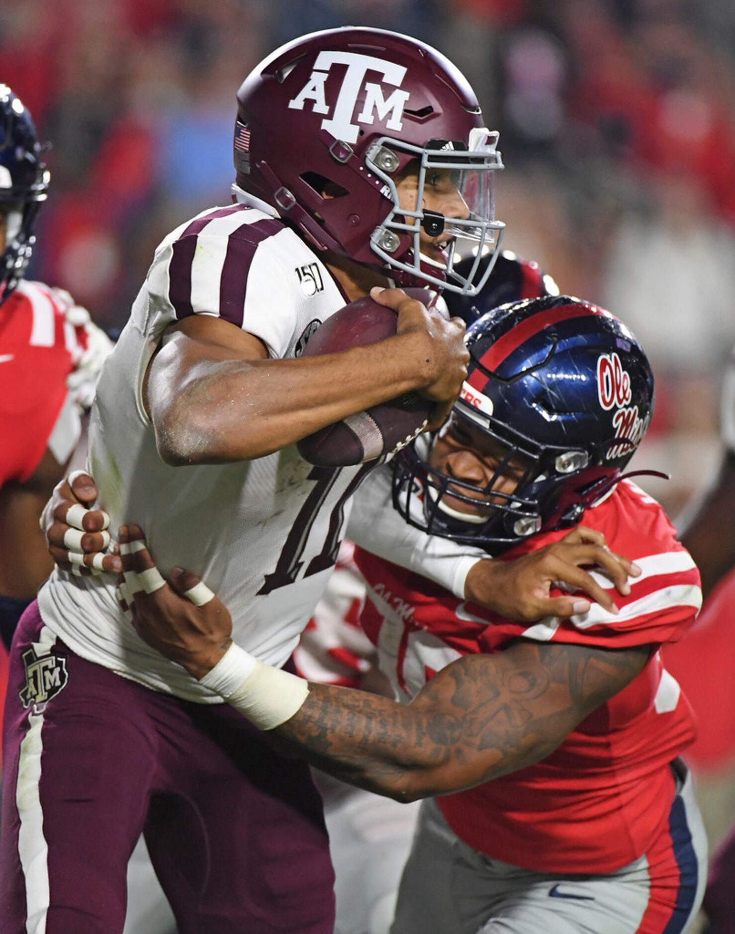 Mississippi linebacker Charles Wiley (99) tackles Texas A&M quarterback Kellen Mond (11)...