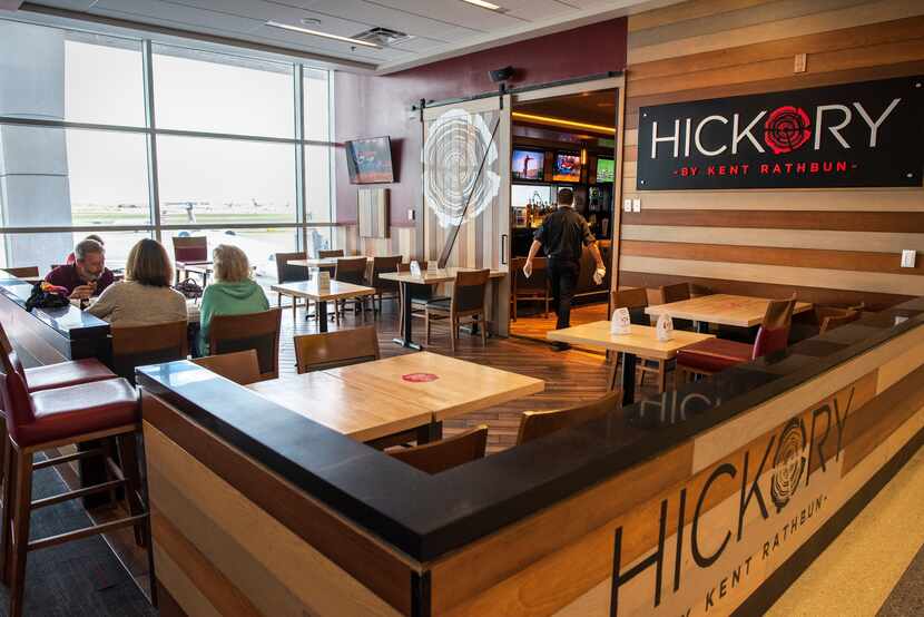 Seating with social distancing at the Hickory restaurant inside Terminal B at DFW...
