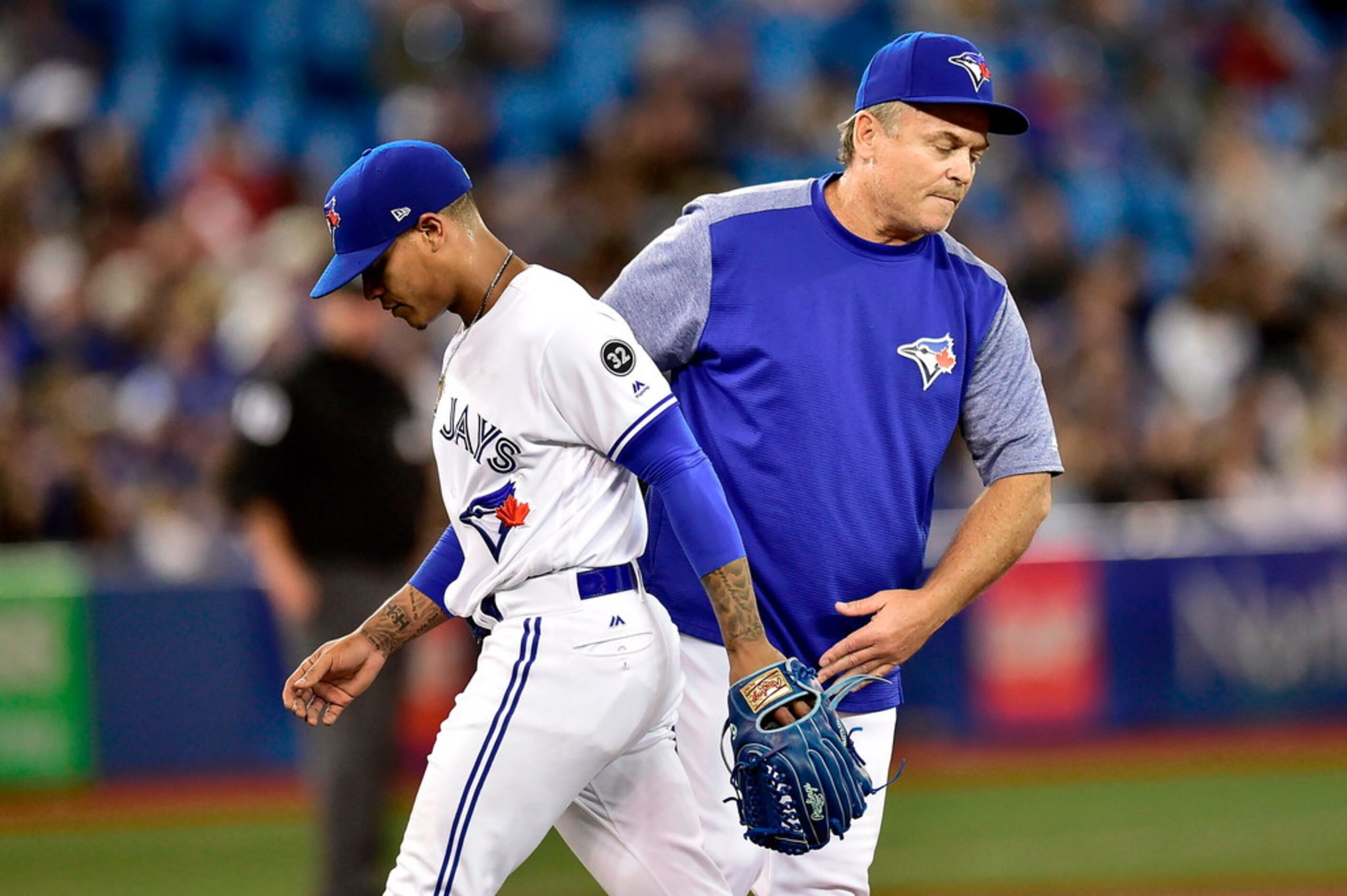 Toronto Blue Jays starting pitcher Marcus Stroman (6) is taken out of the baseball game by...