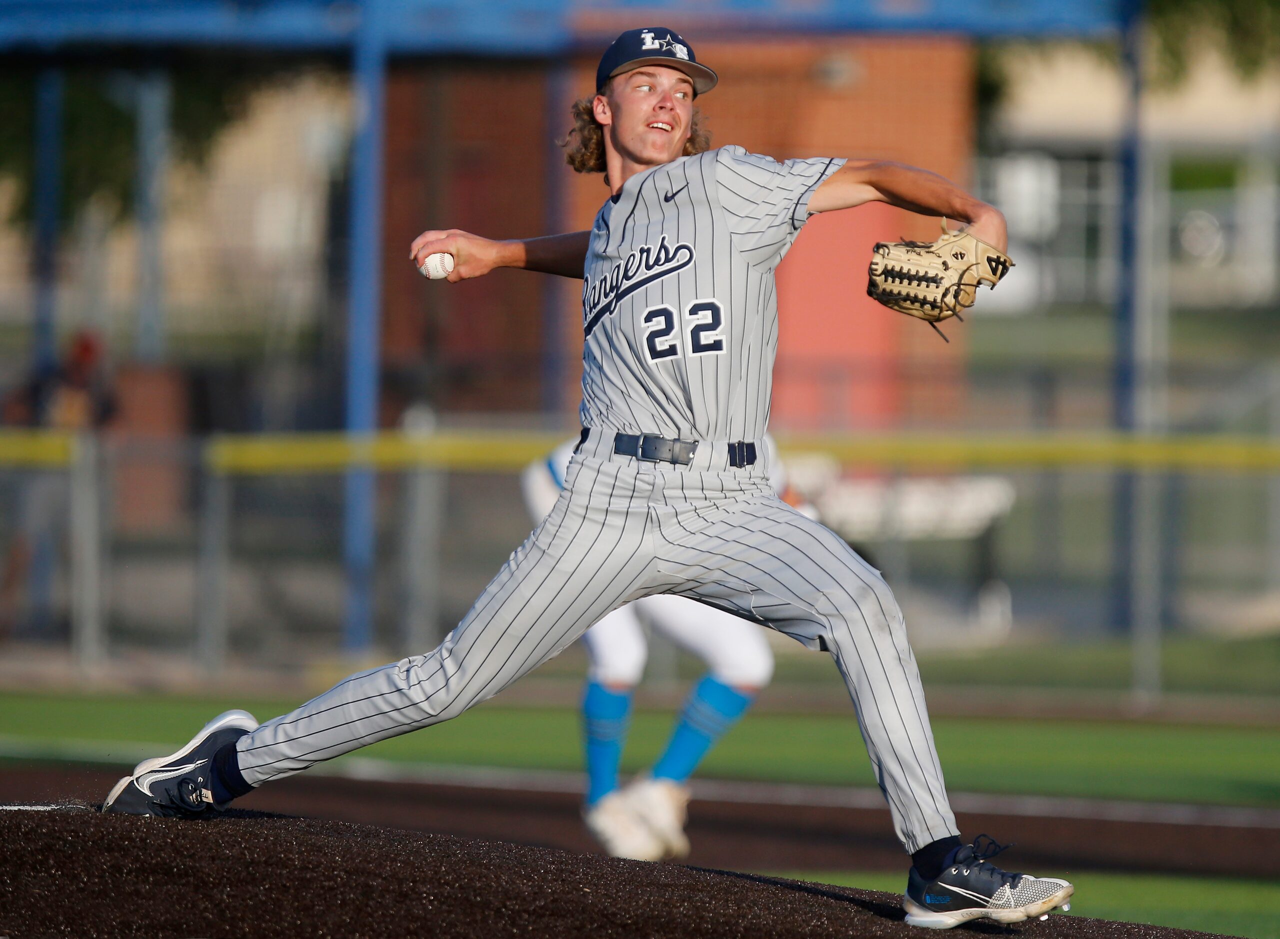 Lone Star High School pitcher Dom Reid (22) delivers a pitch in the first inning as Lone...