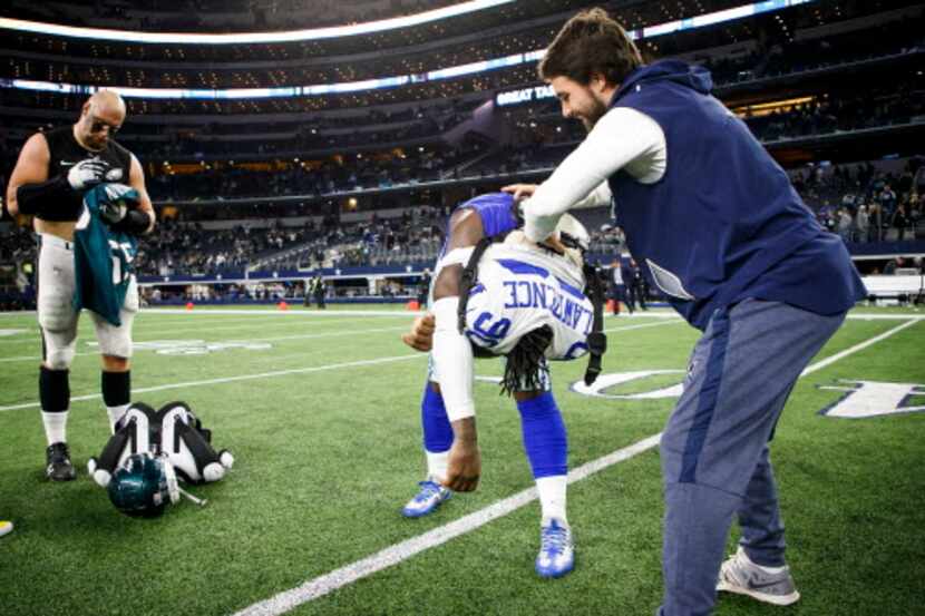 Dallas Cowboys defensive end Demarcus Lawrence (90) exchanges jerseys with Philadelphia...