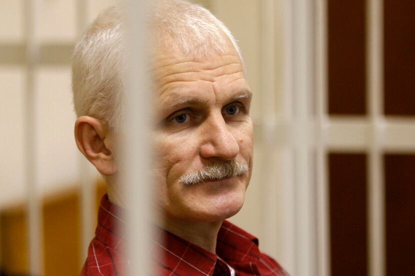 FILE - Ales Bialiatski, the head of Belarusian Vyasna rights group, stands in a defendants'...