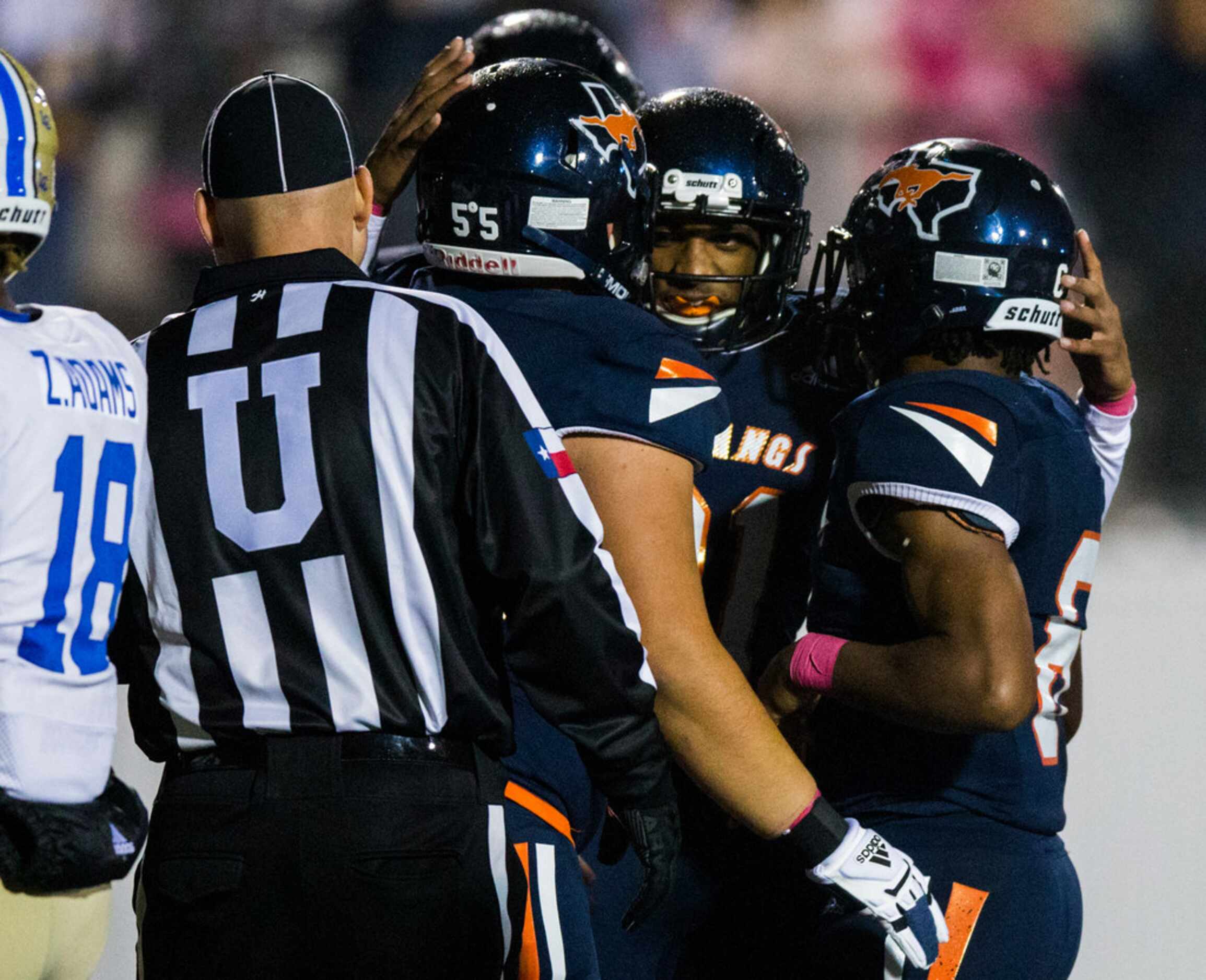 Sachse players celebrate after running back Shon Coleman (6) scored a touchdown during the...