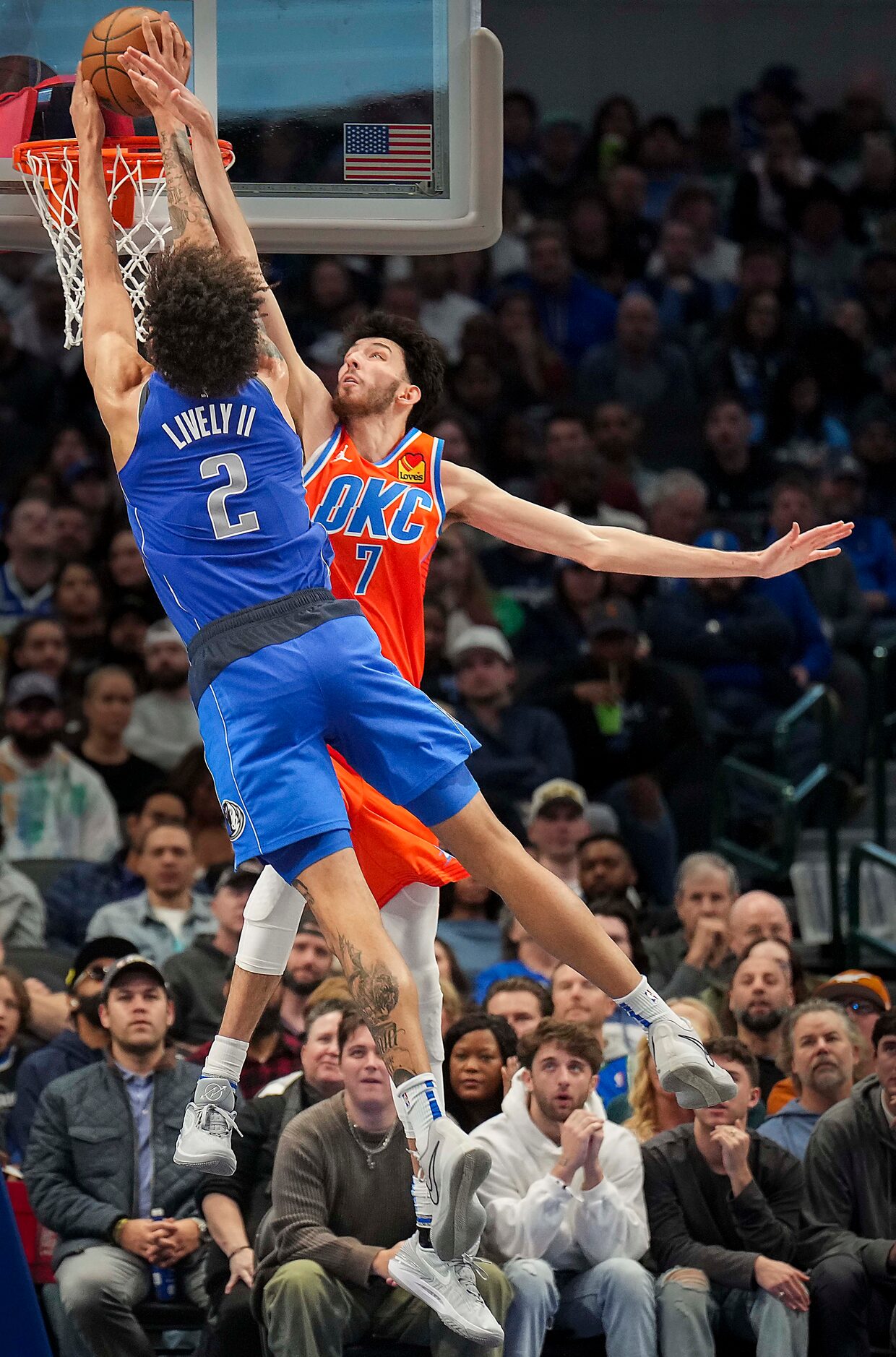 Dallas Mavericks center Dereck Lively II (2) dunks the ball past Oklahoma City Thunder...