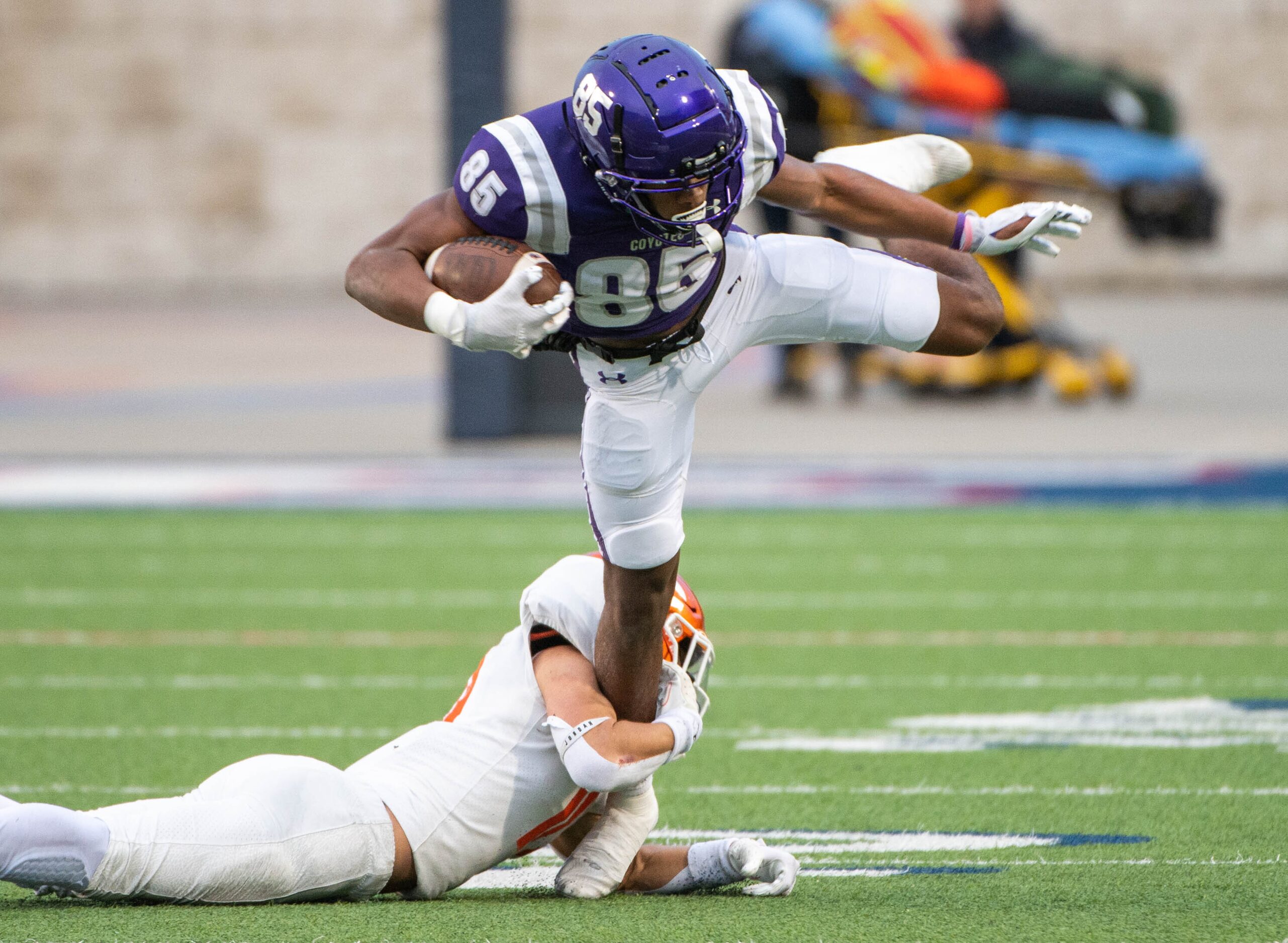 Anna wide receiver Cameron Augurson (85) runs through a tackle attempt by Celina's Cade...